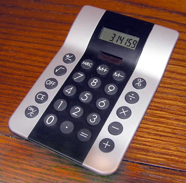 This picture shows a simple calculator with the value of Pi written on the screen.