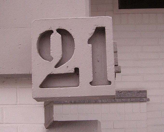 This photo shows the number 21 set in stone.