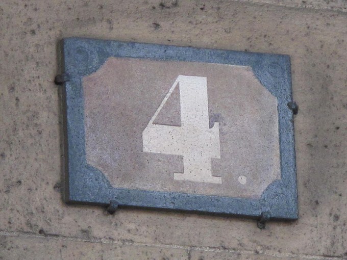 This photo shows the number 4 on a stone plaque.